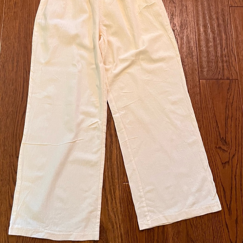 Cream Straight Leg Pants with‎ Modern Minimalist Design